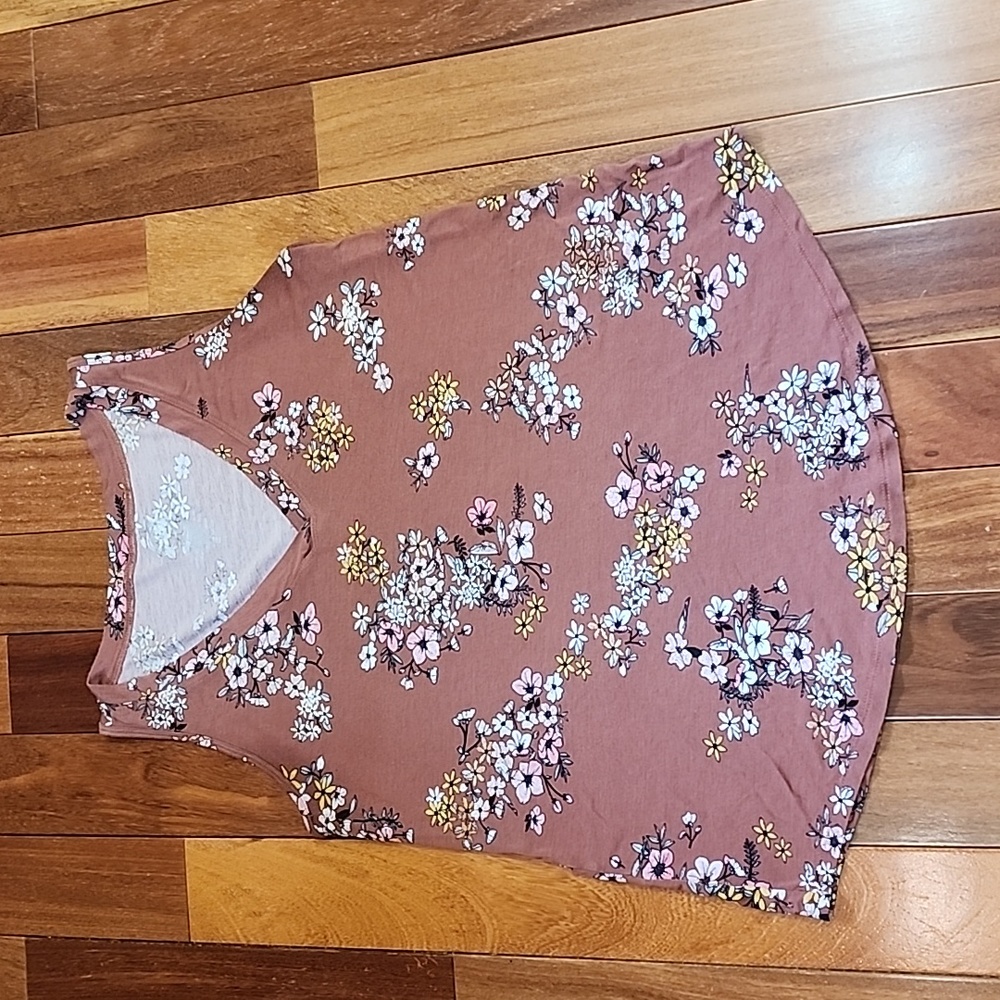 Women's tank top with floral pattern on it.
